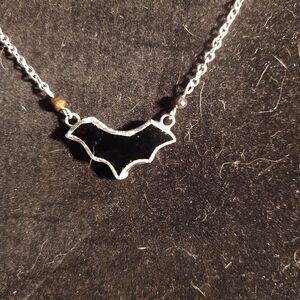 Tiny black stained glass bat necklace